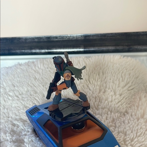 Action Figure on Blue Toy Car - Picture 3 of 6